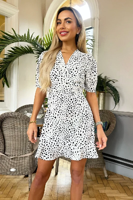 Mini Women Dress with a Short Hem for a Young and Trendy StyleBlack And White Animal Print Wrap Top Mini Dress